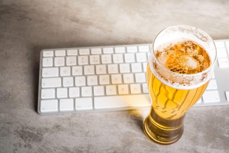 A beer and Mac keyboard
