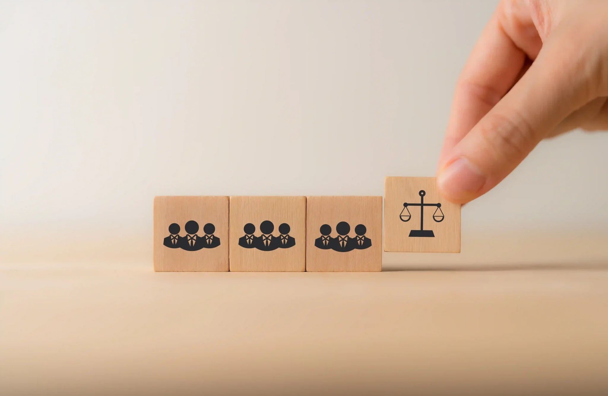 Compliance with employment laws concept with wooden blocks