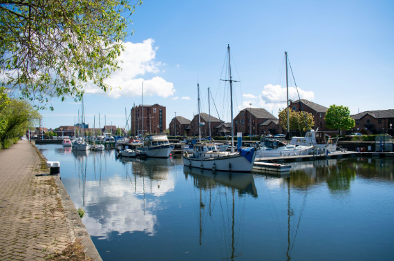 Riverside with multiple boats docked