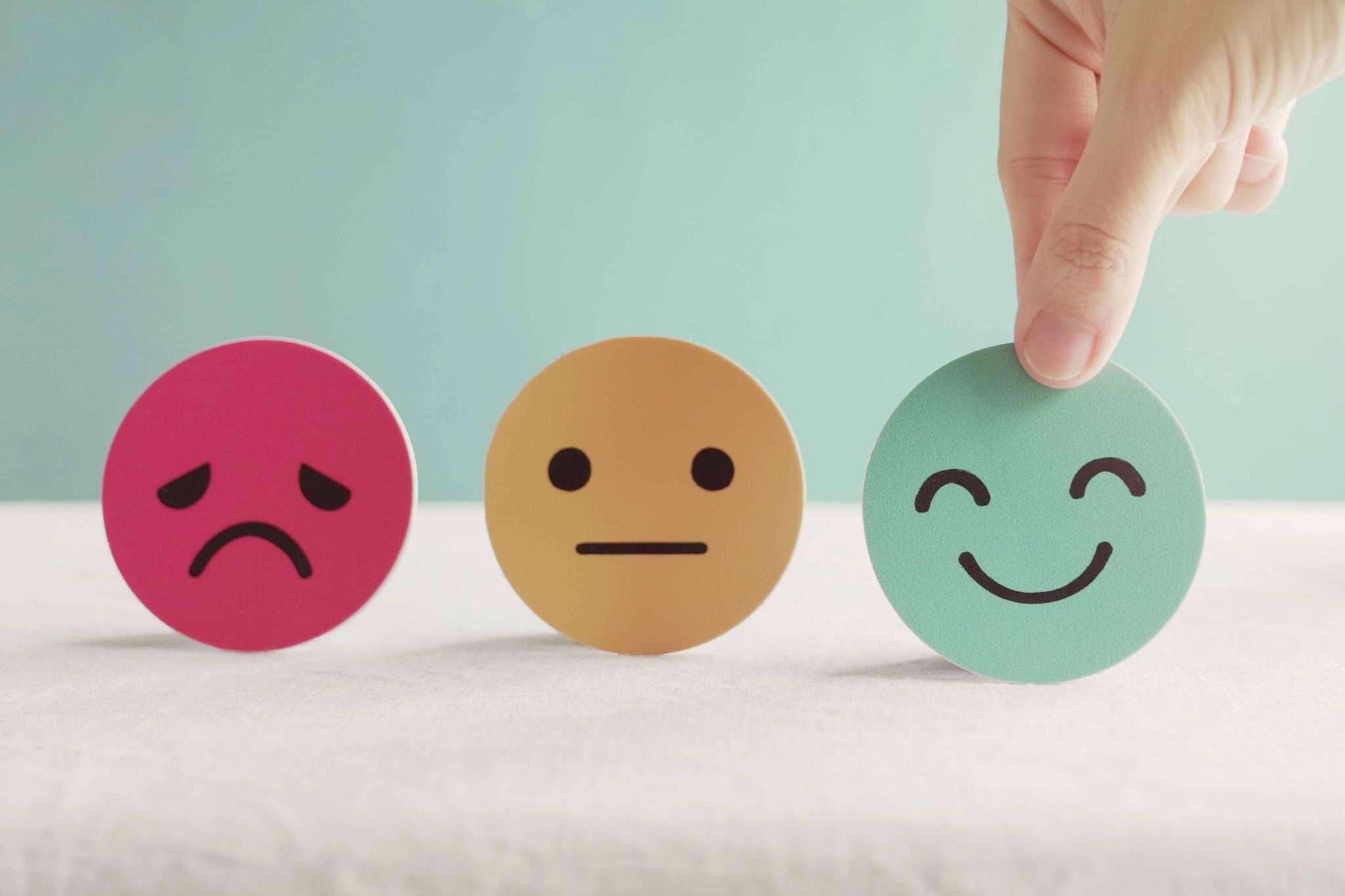 Three circle cards with different colours and expressions