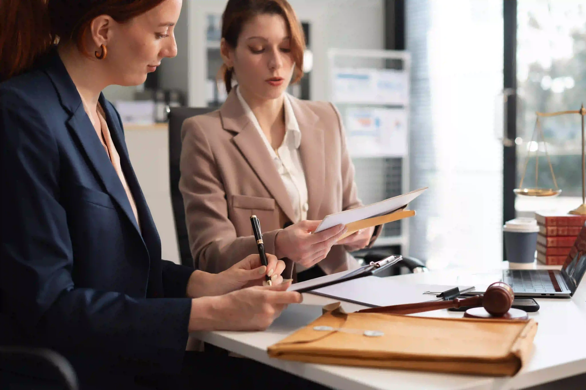Lawyers and business professionals discuss contract papers at the office. legal and corporate consultation concept focusing on law, advice, and business agreements.