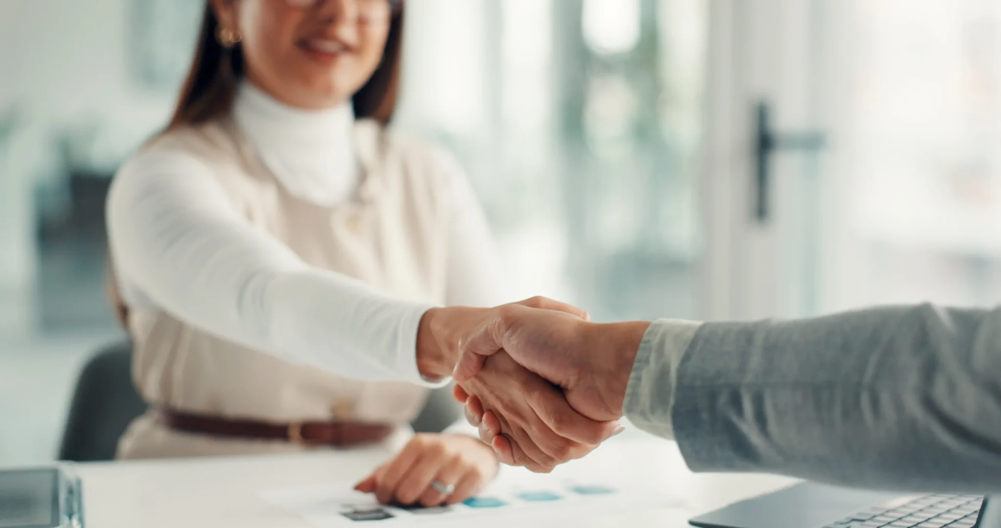 Business, HR manager and handshake with candidate for agreement, onboarding and opportunity